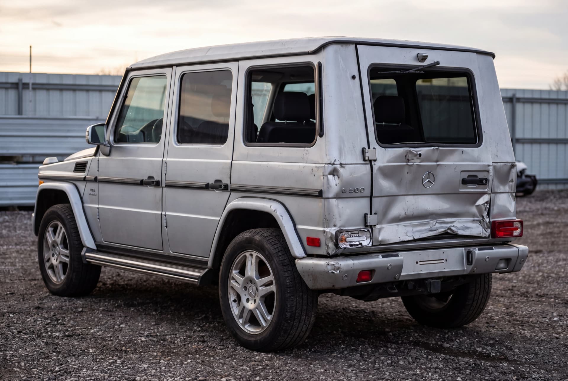 A totaled Silver 2003 Mercedes-Benz G-Class G500 after a rear-end collision