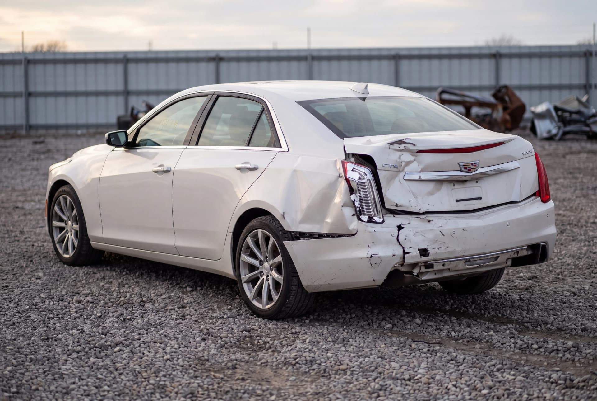A totaled Pearl White 2017 Cadillac CTS Luxury after a rear-end collision